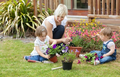 Worker using protective equipment during garden maintenance